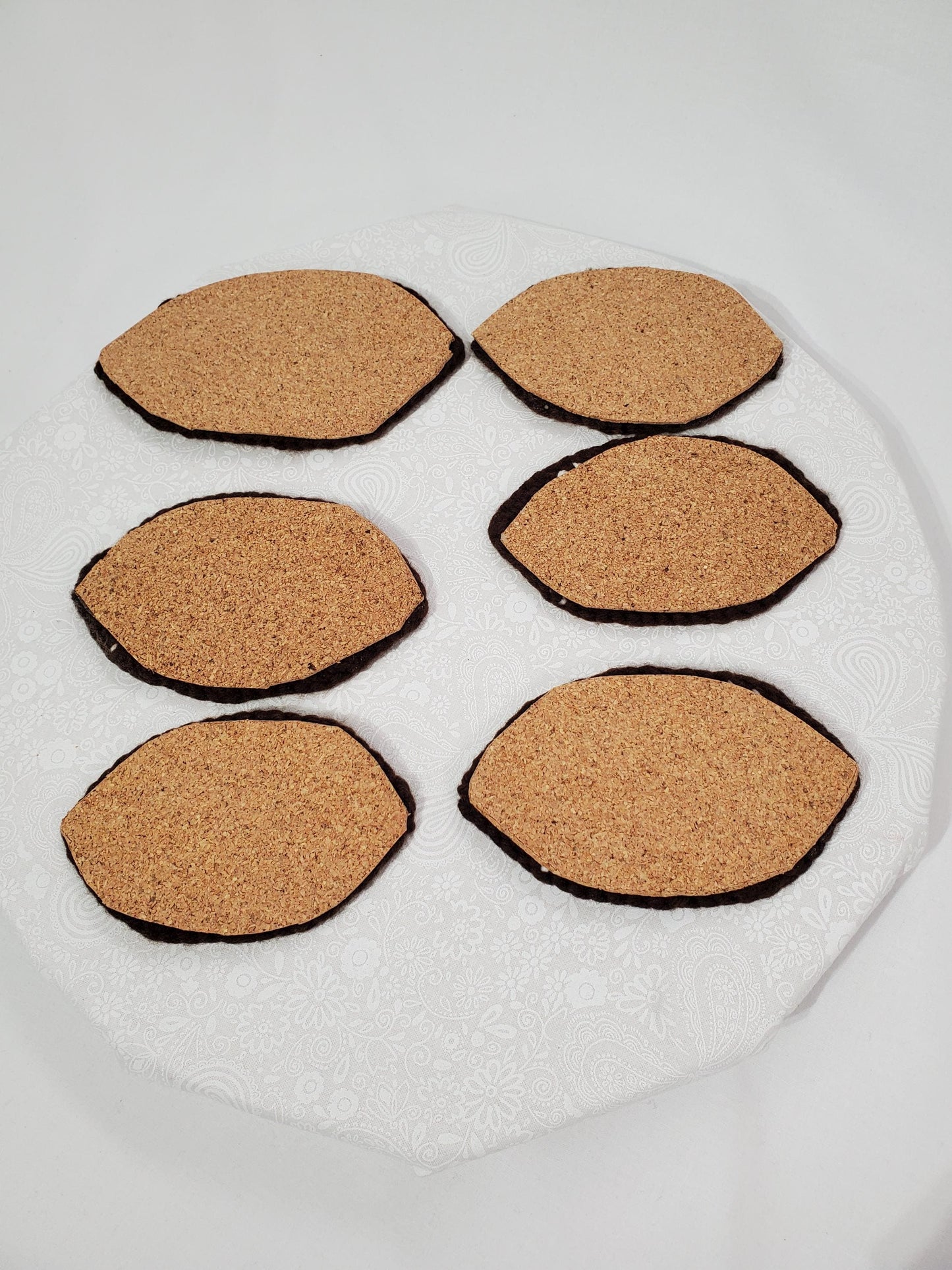 Item C4: Crochet Football Coasters with Cork backing, made with acrylic yarn, set of 6