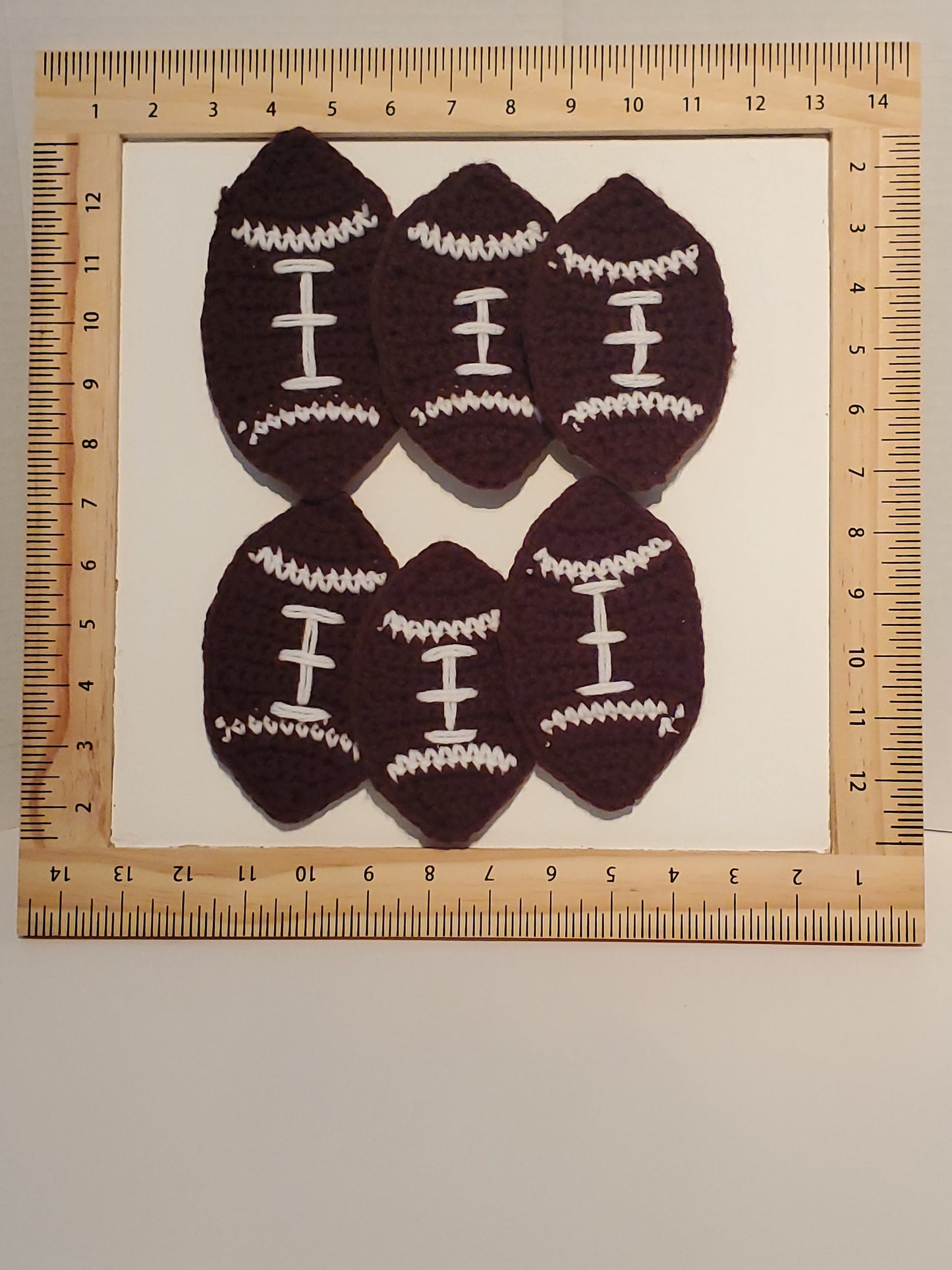 Item C4: Crochet Football Coasters with Cork backing, made with acrylic yarn, set of 6
