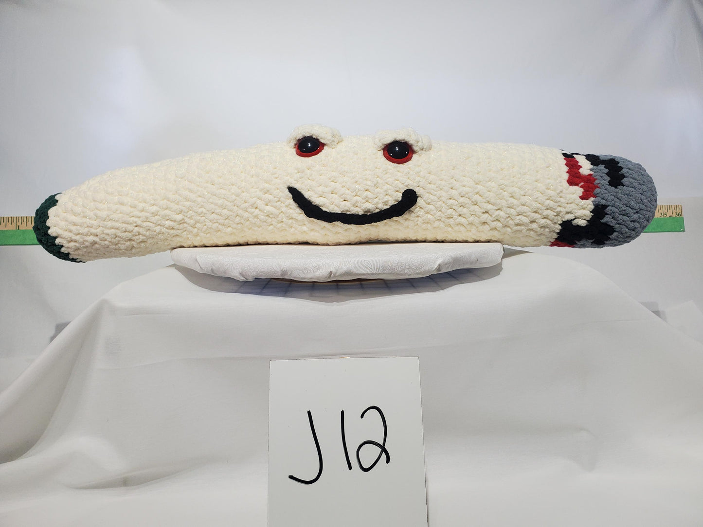 J12 - Crochet Joint / Doobie, White 100% polyester soft blanket yarn, has safety eyes, approx. 28"x 5", 1 lb., 12 oz