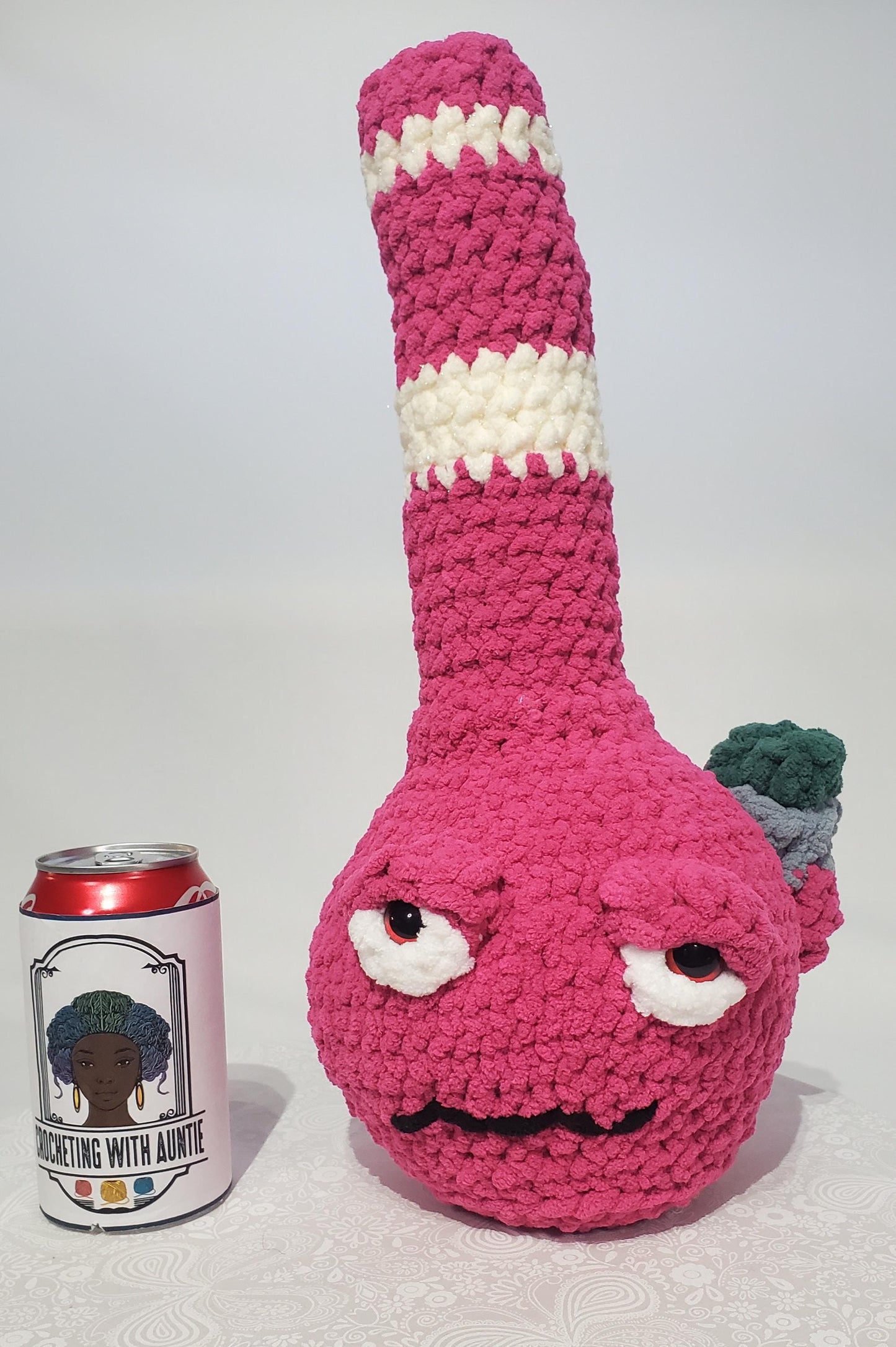 B8: Crochet Bong, Pink and white, made with 100% polyester, soft blanket yarn, and safety eyes, approx. 16" x 7", 13 oz