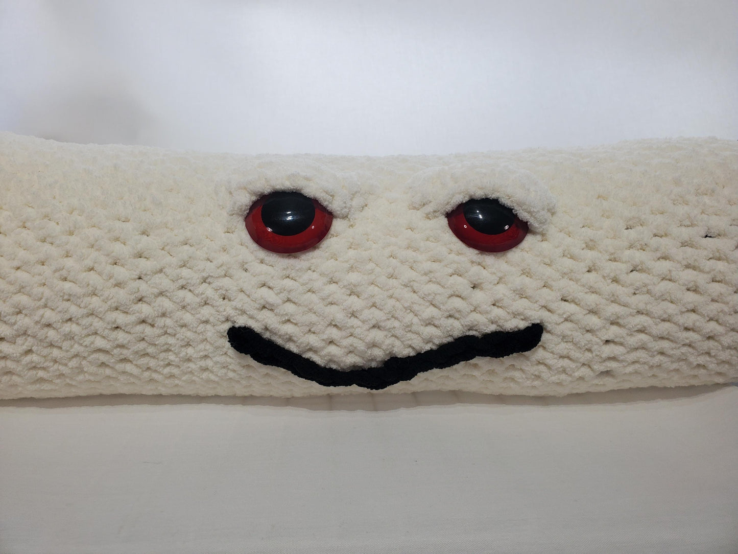 J13 - Crochet Joint / Doobie, White 100% polyester soft blanket yarn, has safety eyes, approx. 32"x 6", 2 lb., 12 oz