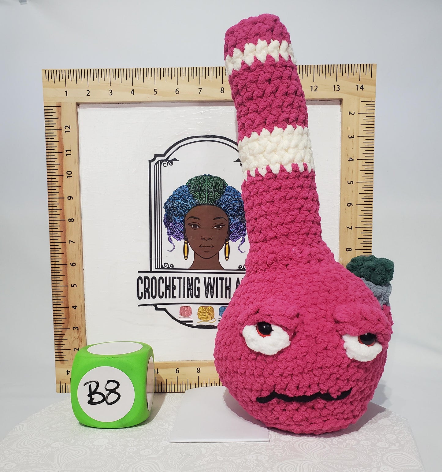 B8: Crochet Bong, Pink and white, made with 100% polyester, soft blanket yarn, and safety eyes, approx. 16" x 7", 13 oz