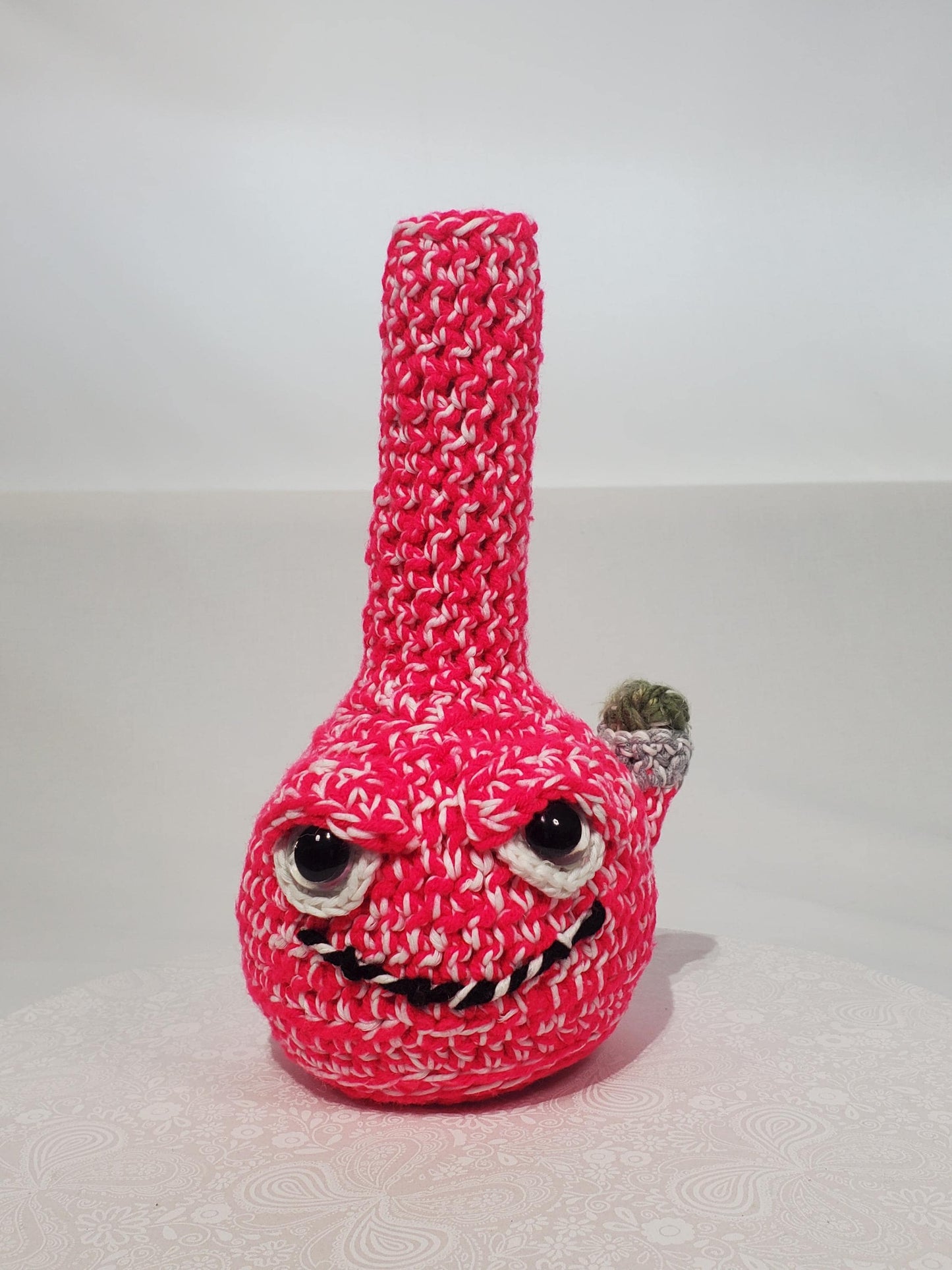 B1: Crochet Bong, Pink and White - GLOWS IN DARK, made with acrylic and cotton yarn, has safety eyes, approx. 10" x 5", 8 oz