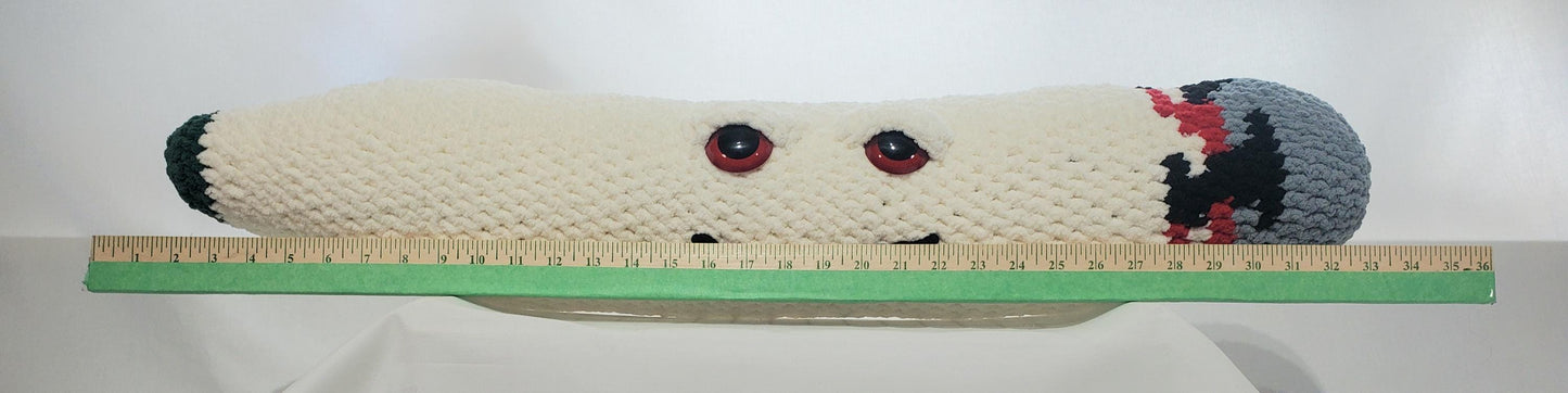 J13 - Crochet Joint / Doobie, White 100% polyester soft blanket yarn, has safety eyes, approx. 32"x 6", 2 lb., 12 oz