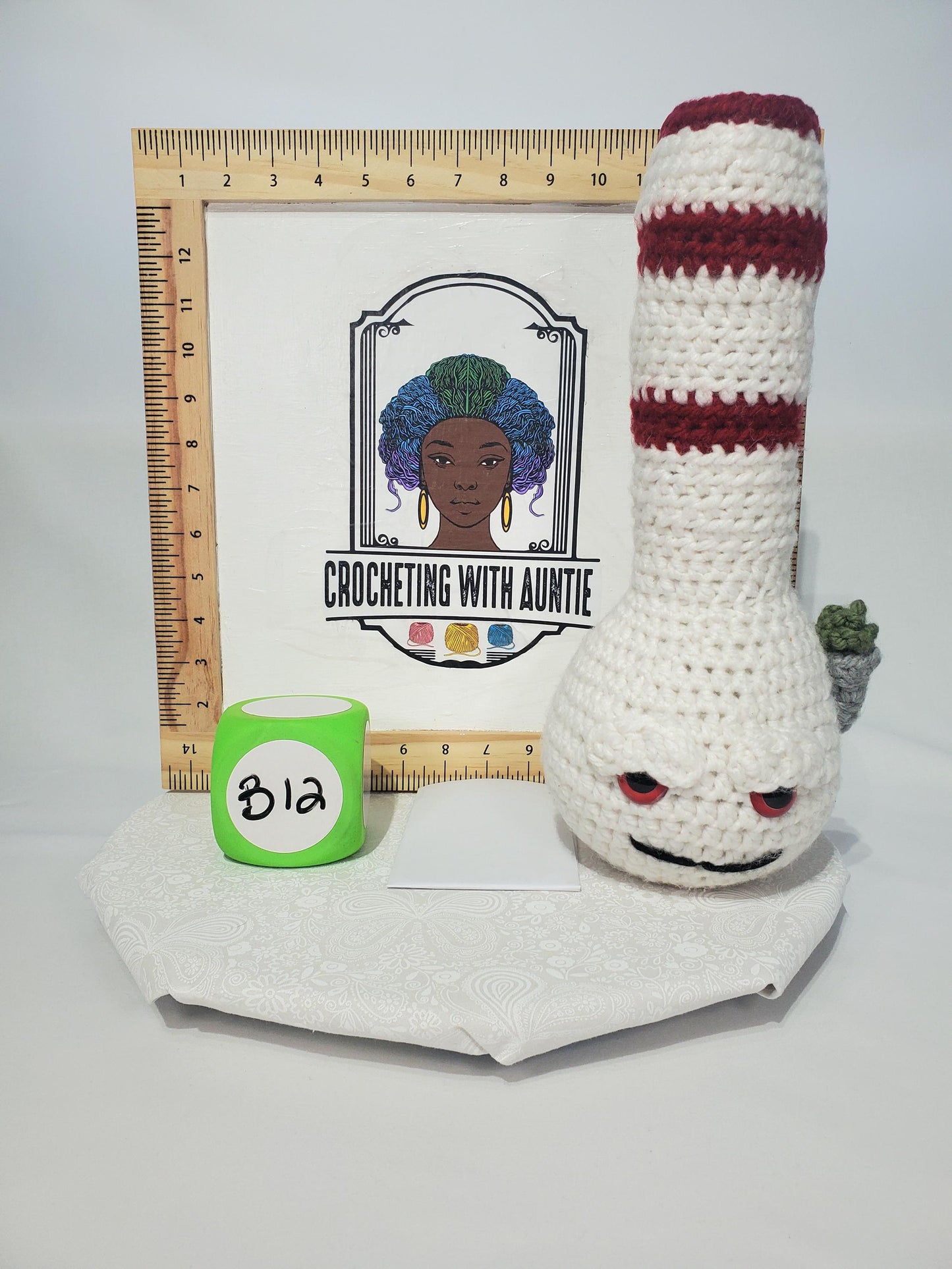 B12: Crochet Bong, White and Maroon, made with thick, 100% acrylic yarn, and safety eyes, approx. 14" x 6", 11 oz