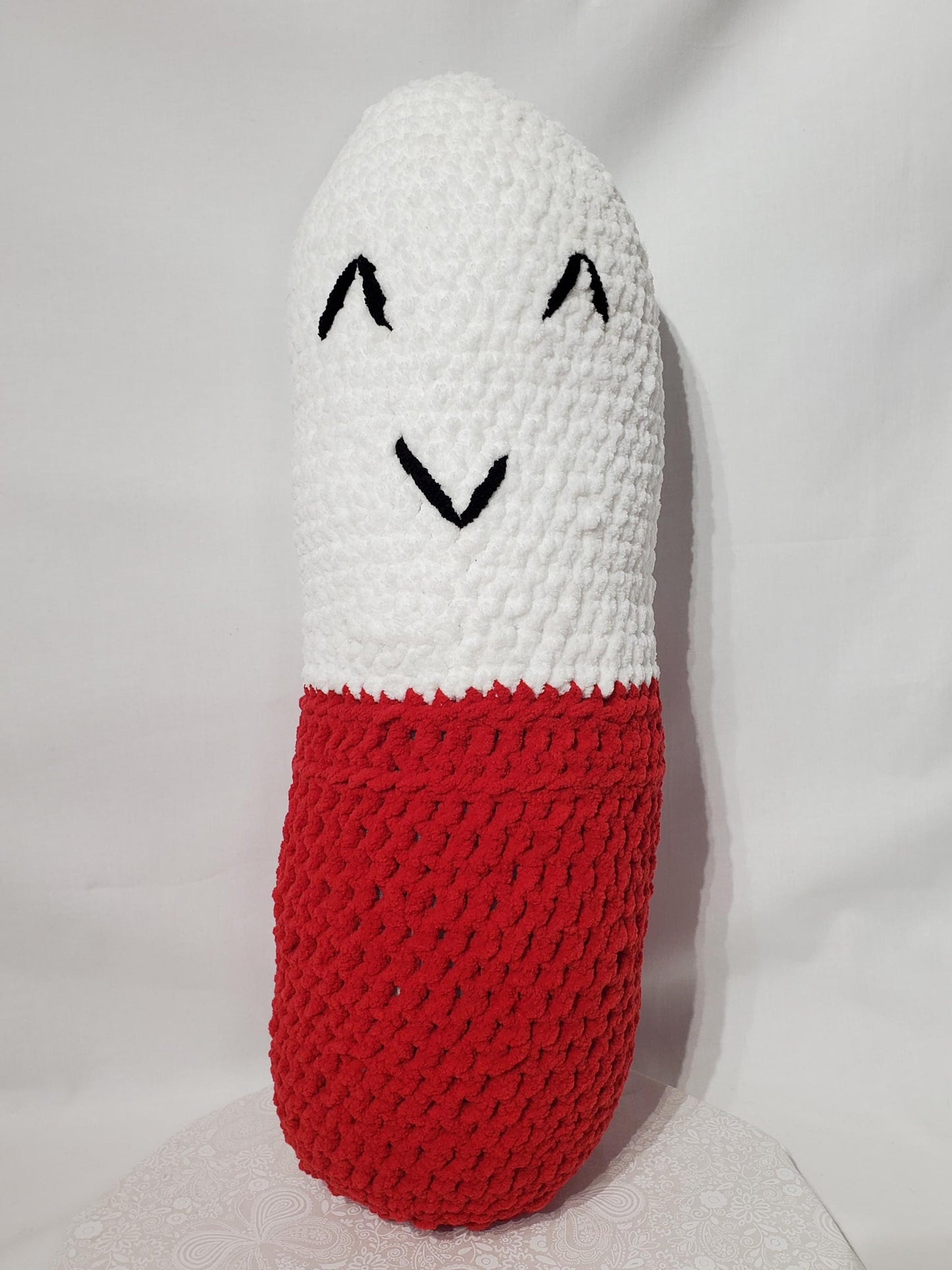 Crochet chill Pill Stuffy /Pillow, Red and White, made with soft blanket yarn (100% polyester), and fiber fill, approx. 23”x8”