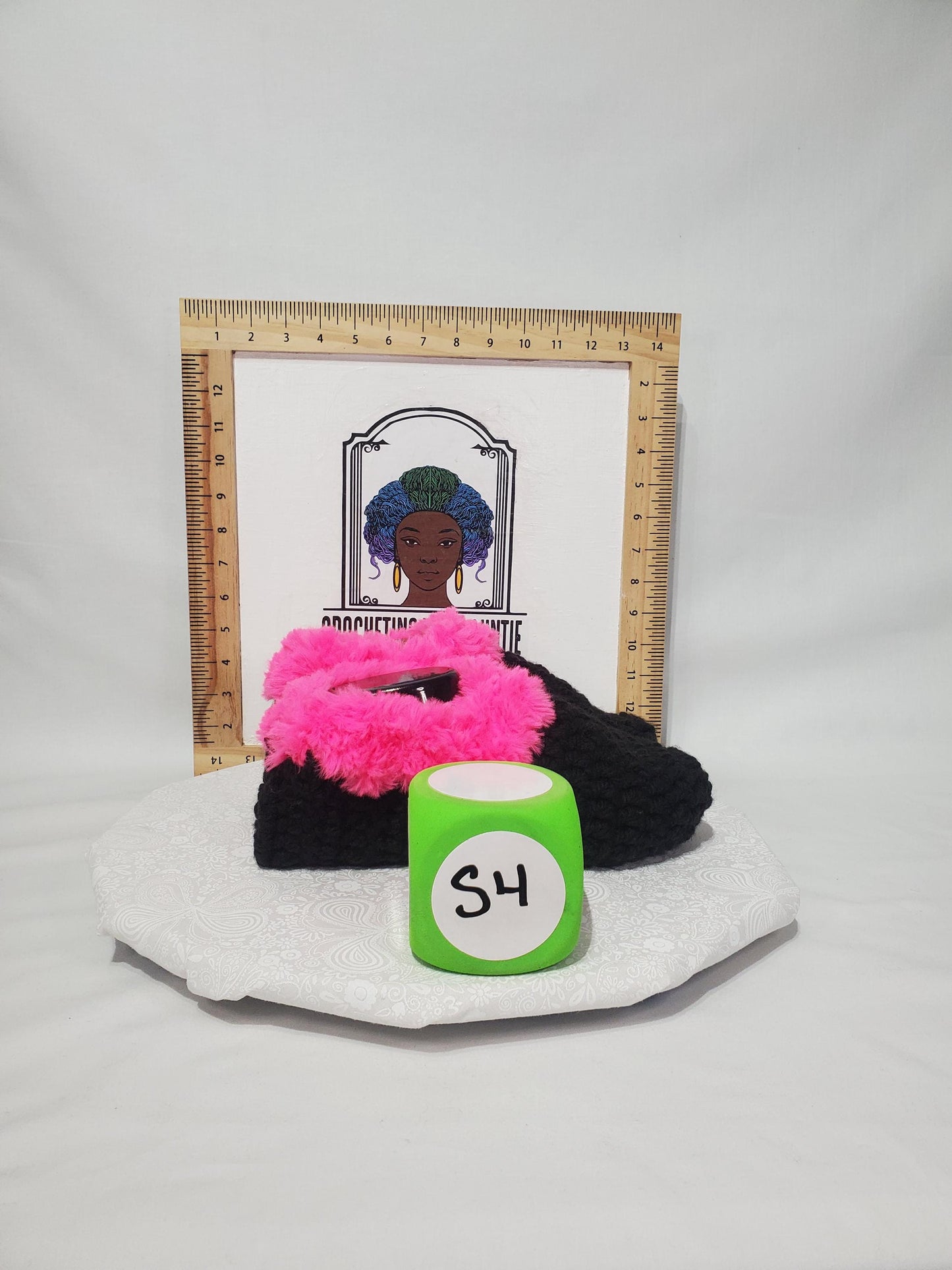 Item S4: Black slippers with pink fur, made with 100% acrylic chunky yarn, Women's size 9/10