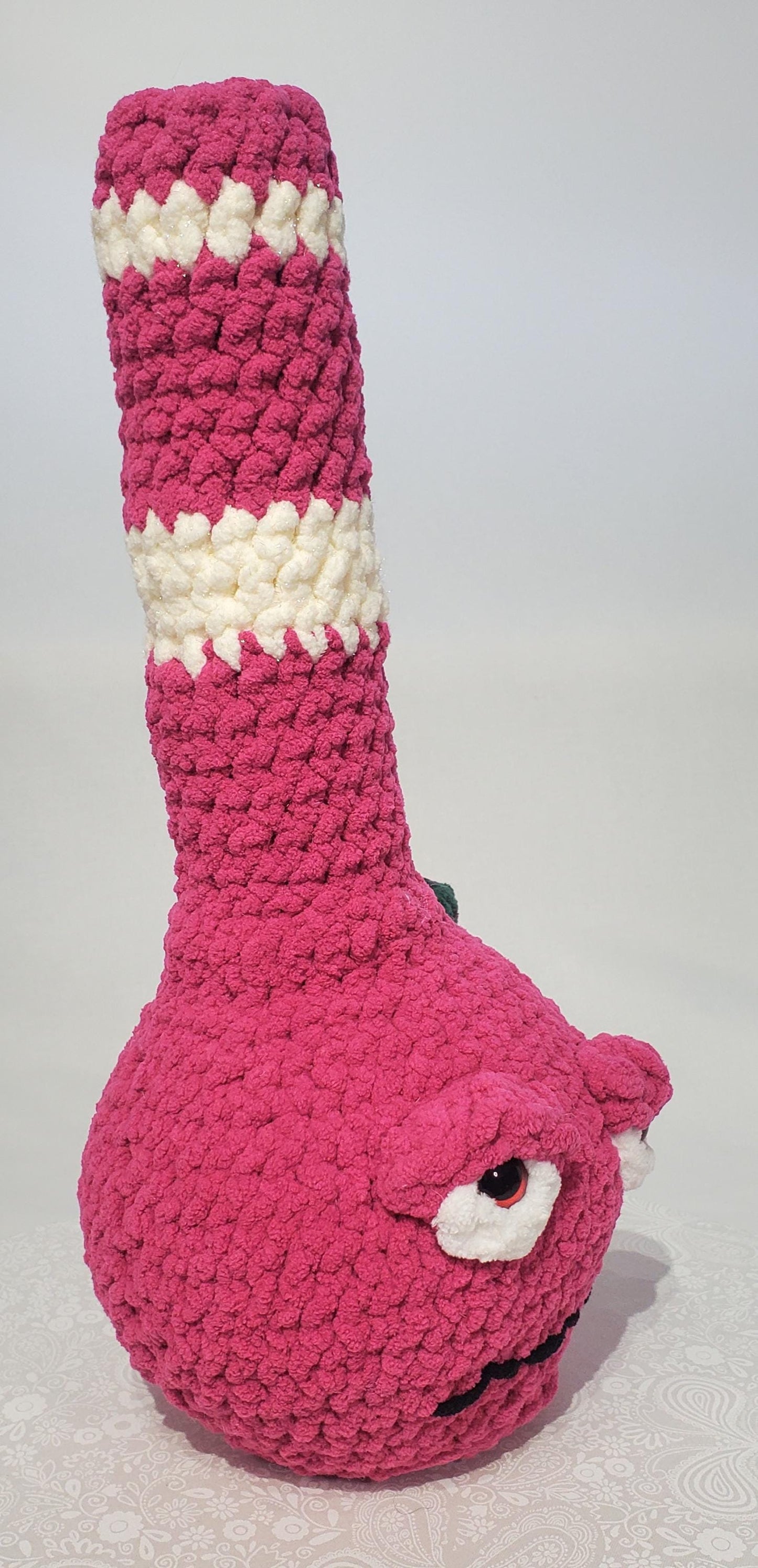 B8: Crochet Bong, Pink and white, made with 100% polyester, soft blanket yarn, and safety eyes, approx. 16" x 7", 13 oz