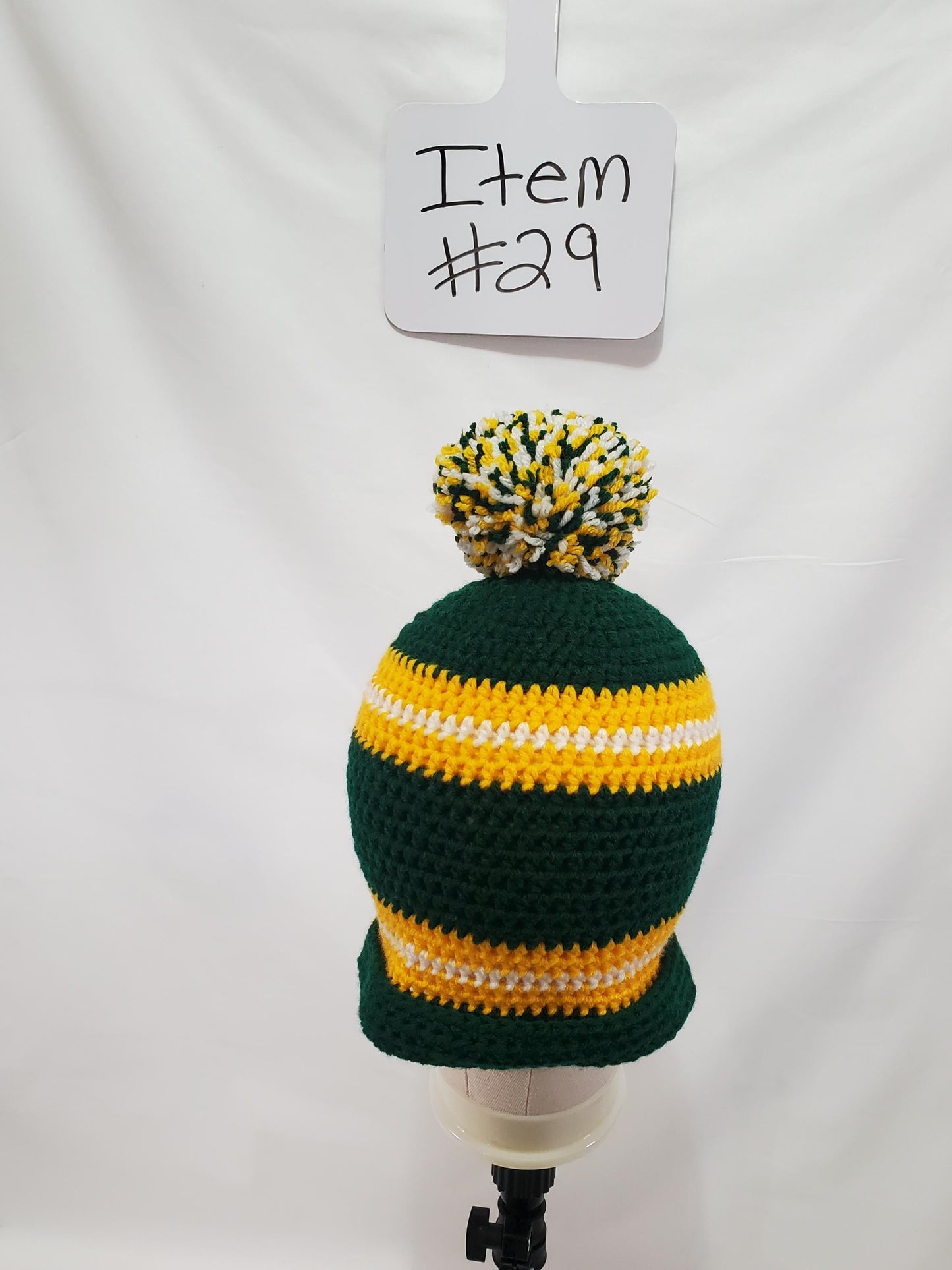 Item #29: Green Bay Packers Inspired Crochet Beanie With A Pom, Adult Size Medium, Made From 100% Of Acrylic yarn
