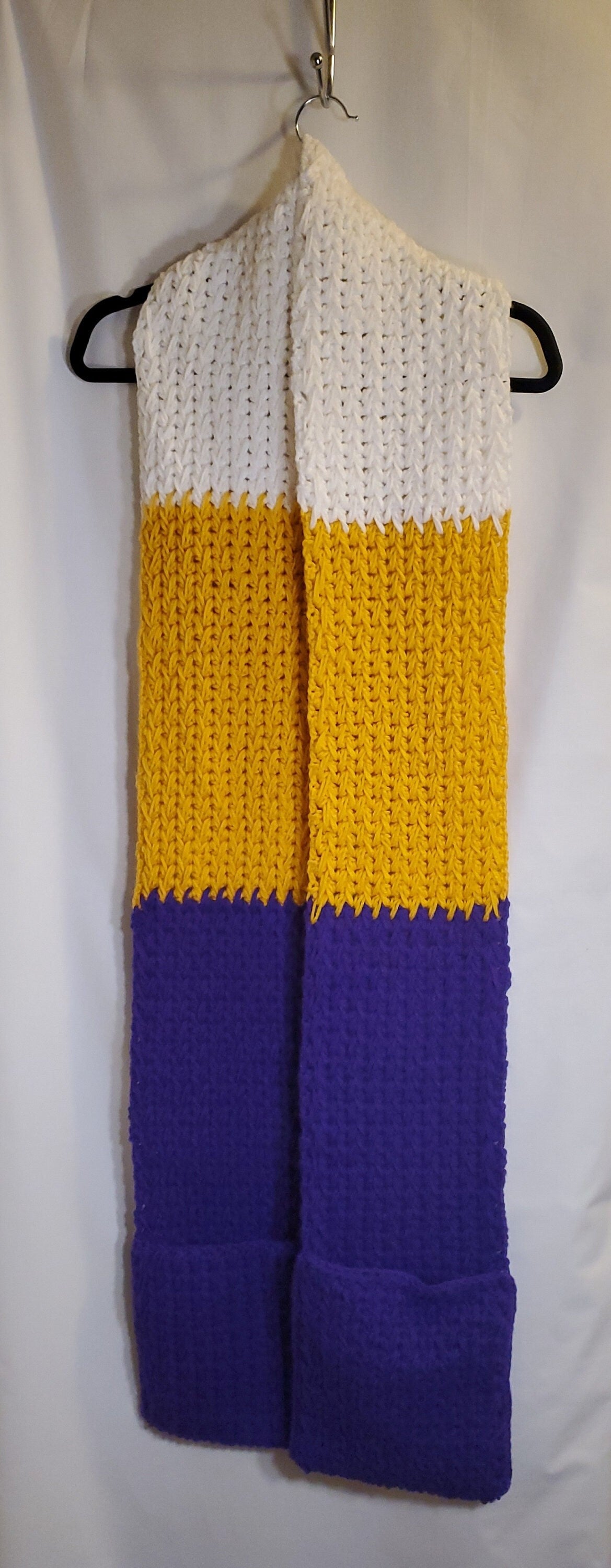 V5: MN Vikings Inspired Scarf with Pockets, 8' long, 7" wide, pockets 9" deep, thick and warm, made with 100% acrylic yarn.