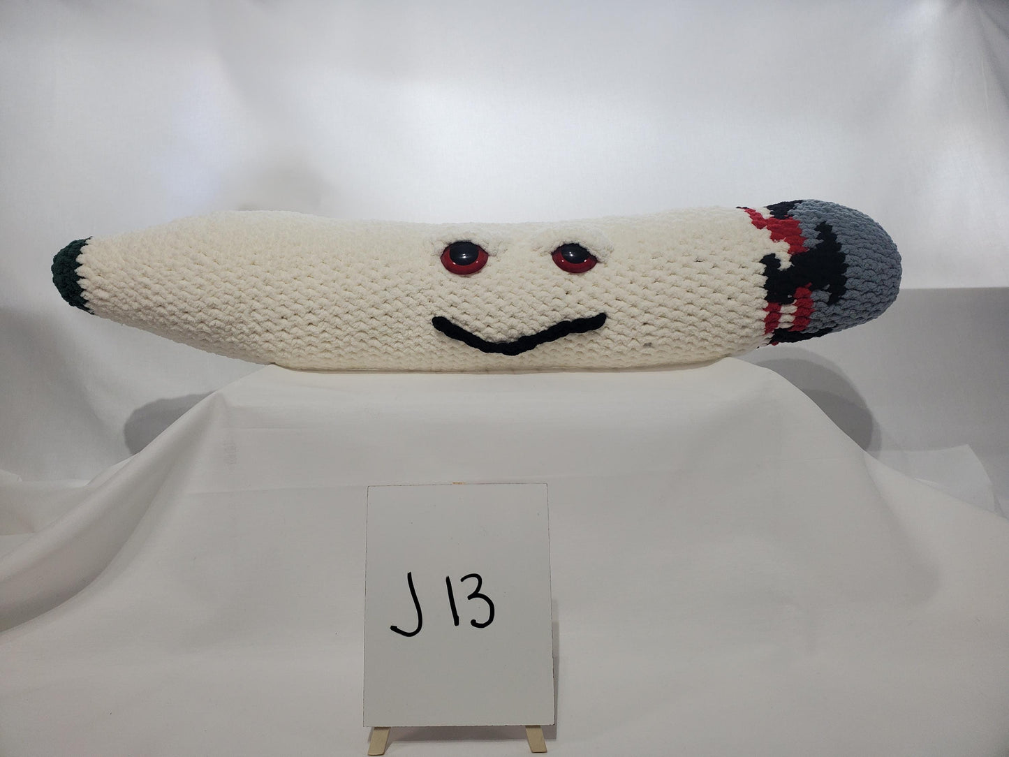 J13 - Crochet Joint / Doobie, White 100% polyester soft blanket yarn, has safety eyes, approx. 32"x 6", 2 lb., 12 oz