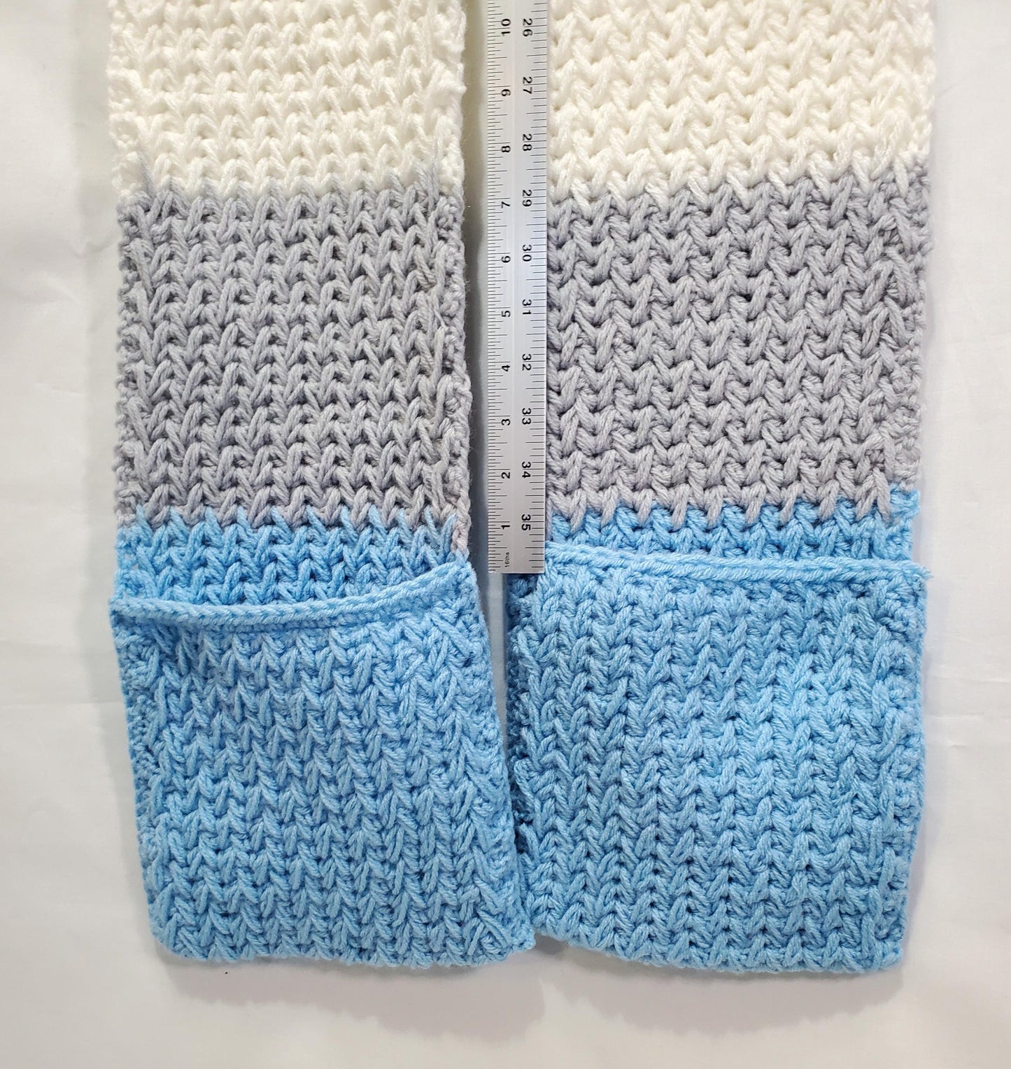 DL1: Detroit Lions Inspired Scarf with Pockets, 7 ft long, 8 in wide, pockets 8 in deep, warm and thick, made with 100% acrylic yarn.