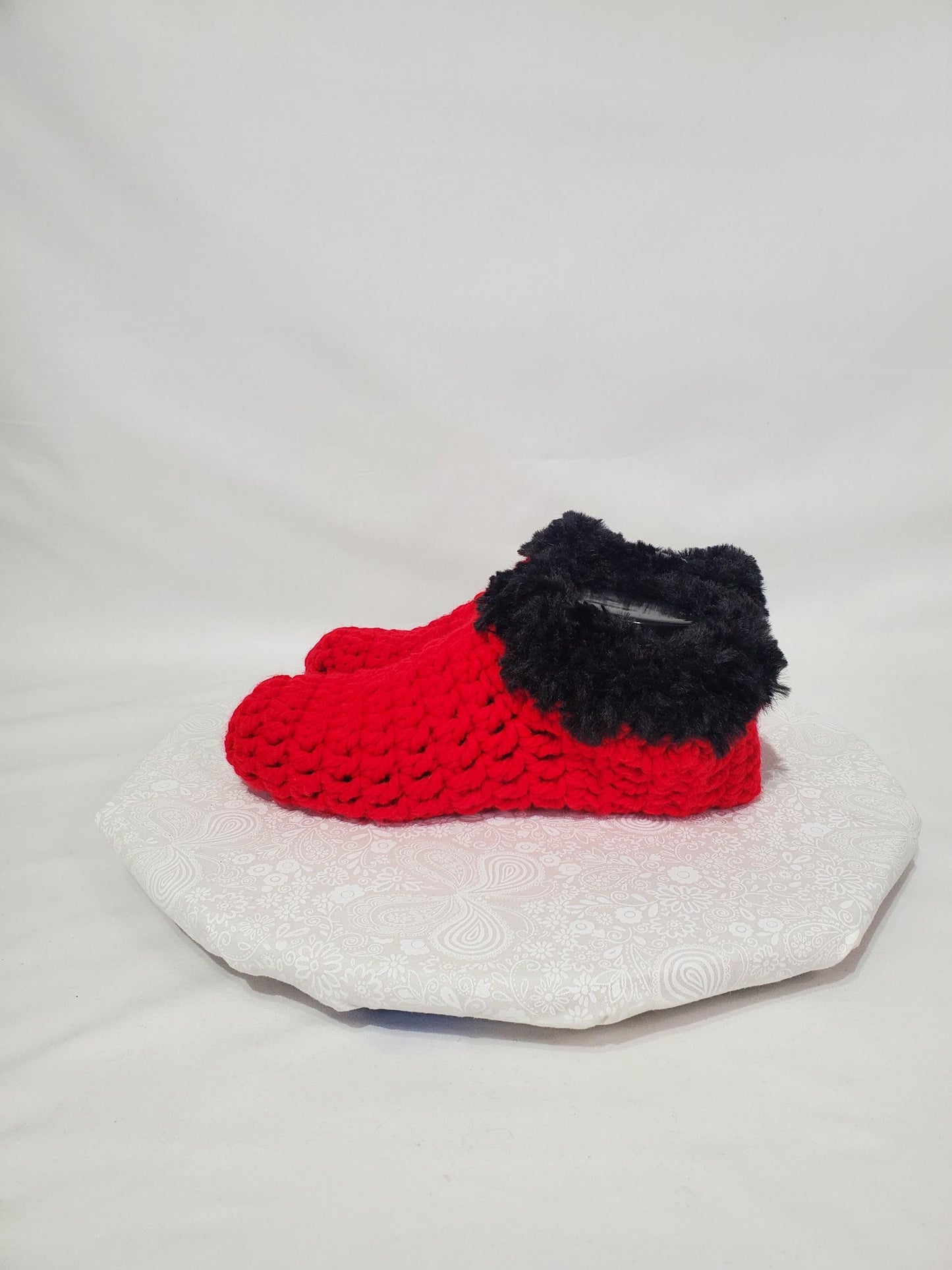 Item S1: Red slippers with black fur, made with 100% acrylic chunky yarn, Women's size 9/10