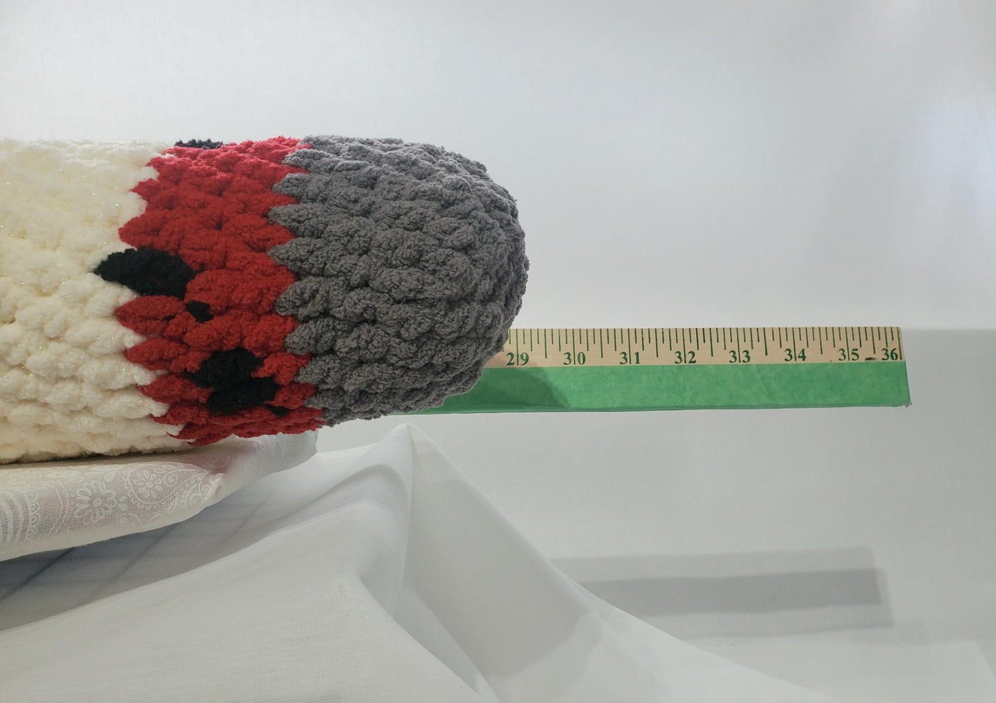 J14: Crochet Joint / Doobie, White 100% polyester soft blanket yarn, has safety eyes, approx. 21"x 4", 13 oz