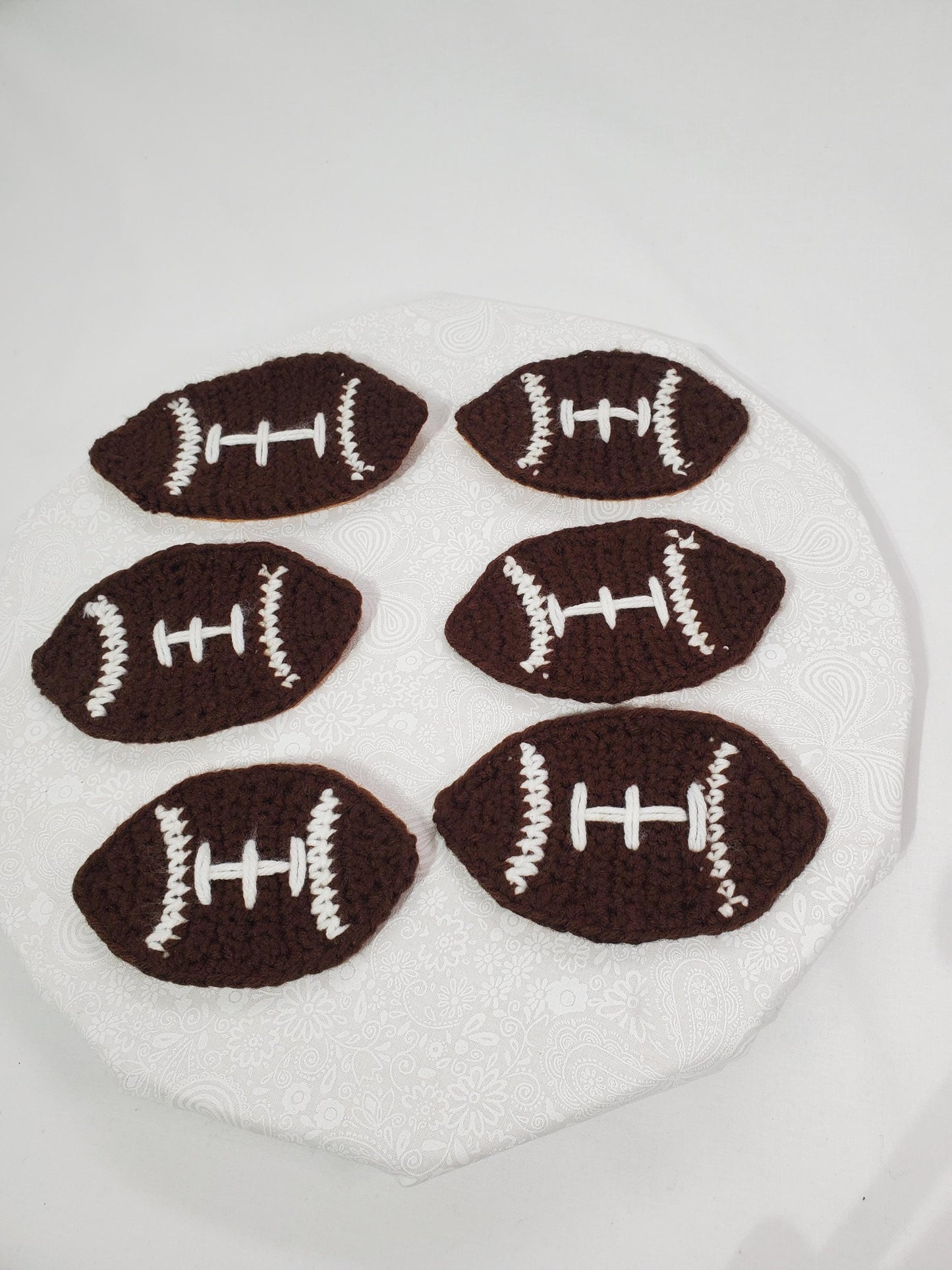 Item C4: Crochet Football Coasters with Cork backing, made with acrylic yarn, set of 6