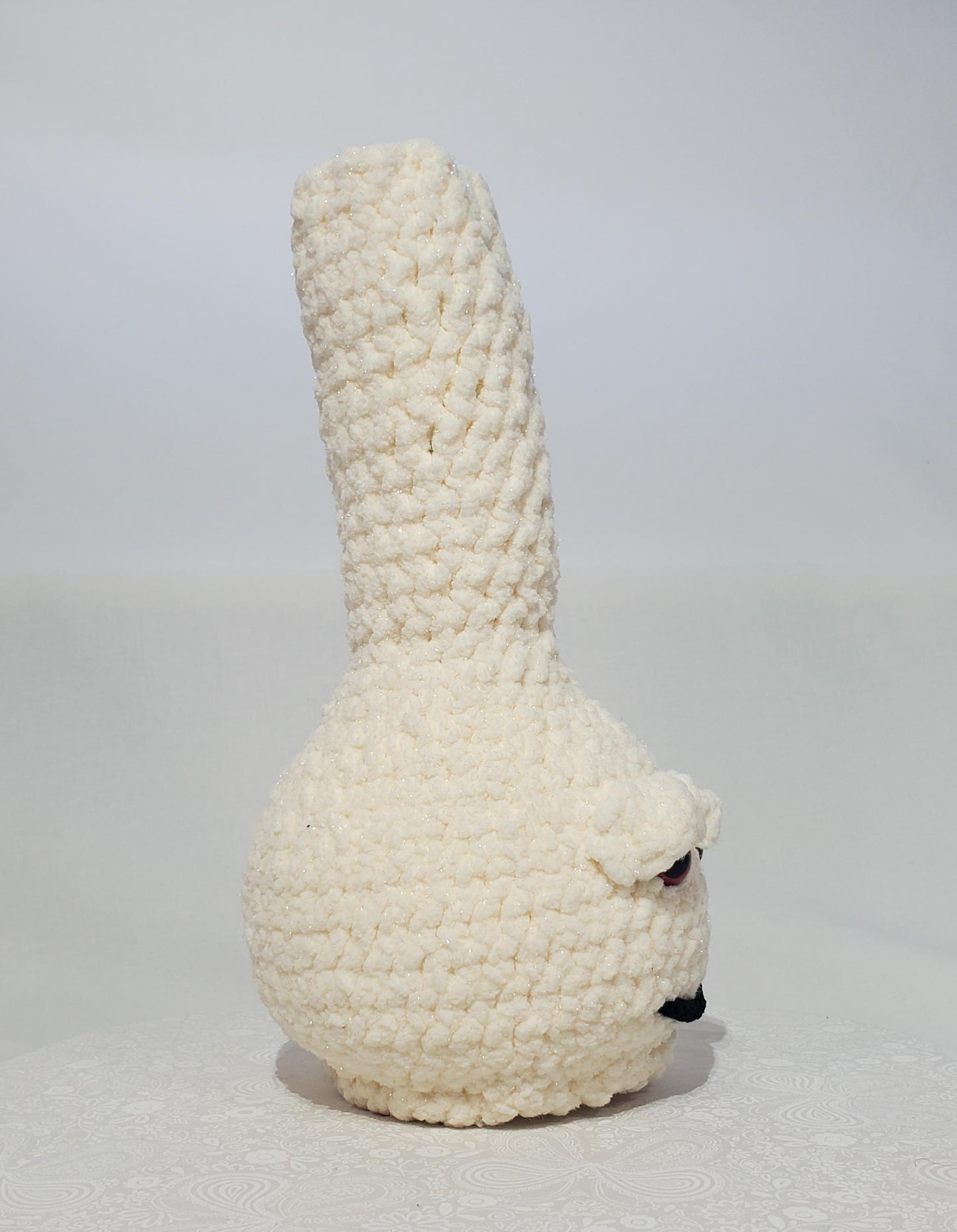 B13: Crochet Bong, Sparkle White, made with 100% polyester, soft blanket yarn, and safety eyes, approx. 12" x 5", 11 oz