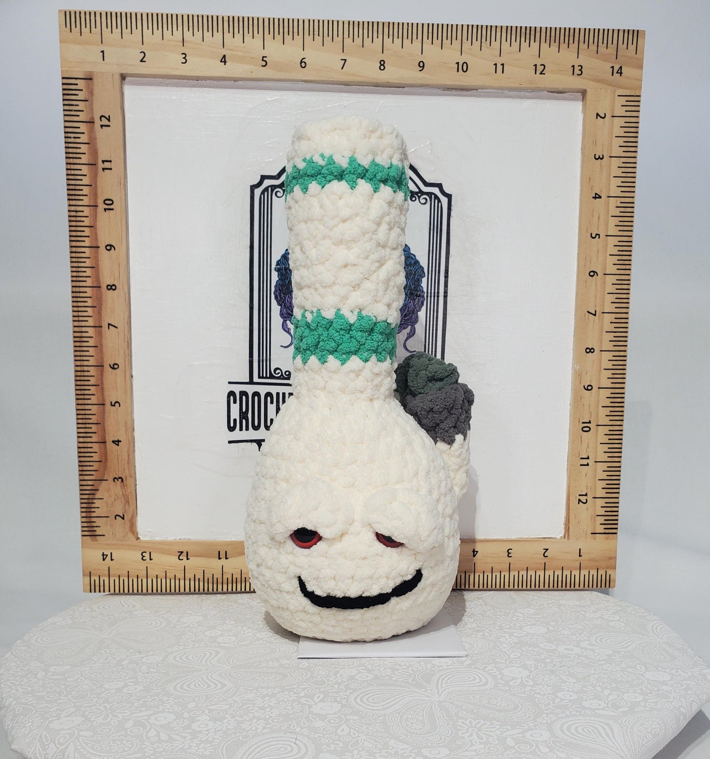 B11: Crochet Bong, White and Teal, made with 100% polyester, soft blanket yarn, has safety eyes, approx. 11" x 4", 7 oz