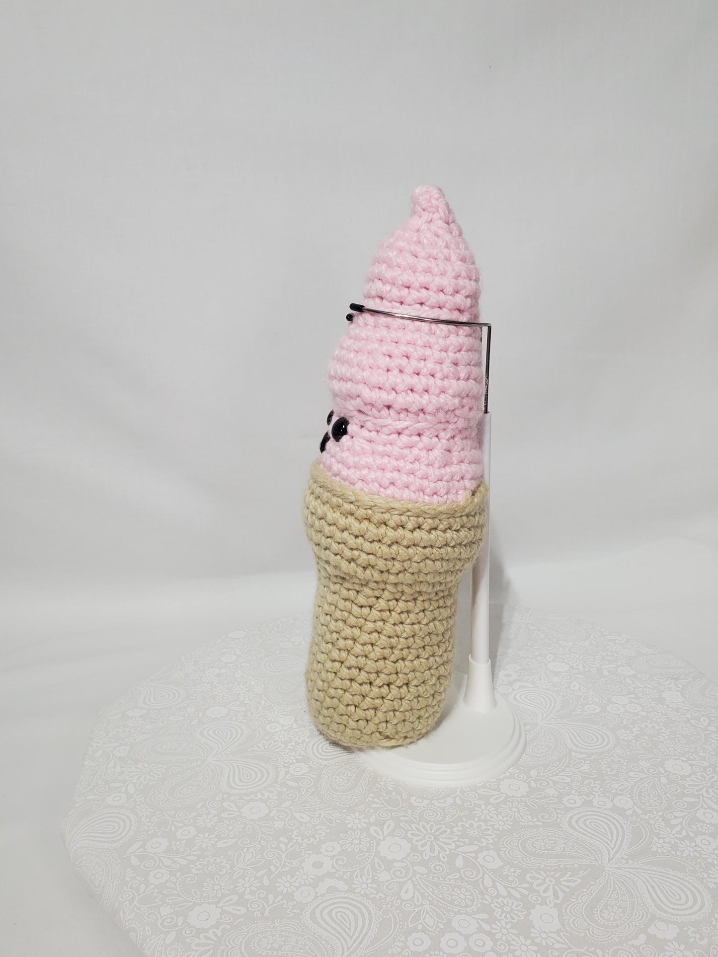 T23: Crochet Swirl Ice Cream Cone, made with 100% acrylic yarn, fiber fill, and plastic safety eyes
