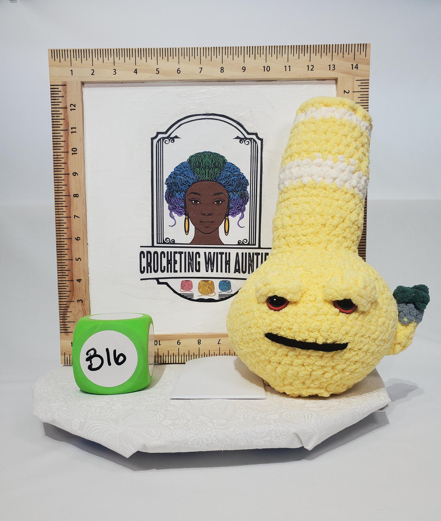 B16: Crochet Bong, yellow and white, made with safety eyes, soft 100% polyester yarn, approx. 12" x 7", approx. 11 oz