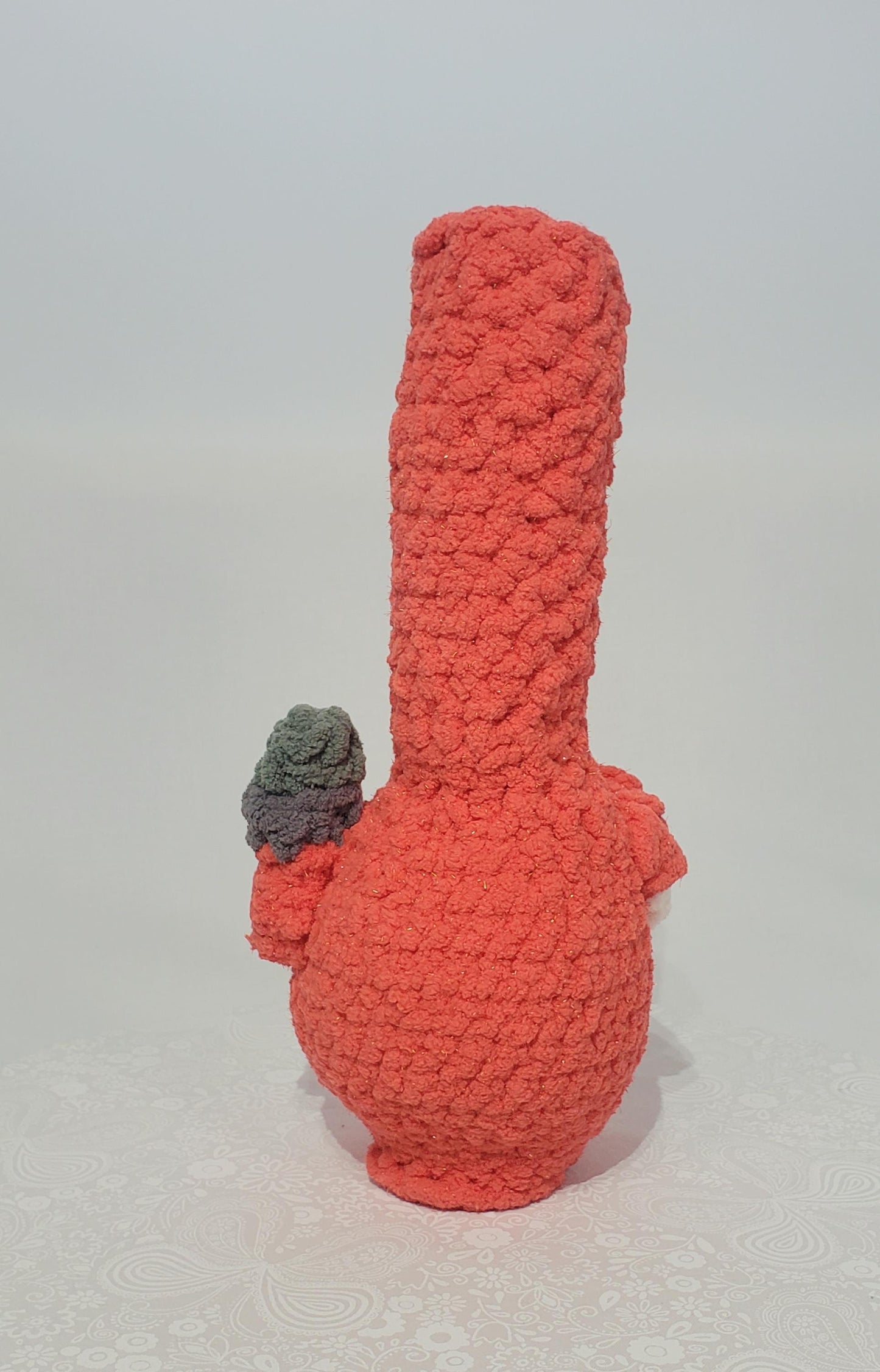 B14: Crochet Bong, Orange, made with 100% polyester, soft blanket yarn, and safety eyes, approx. 11" x 4", 6 oz