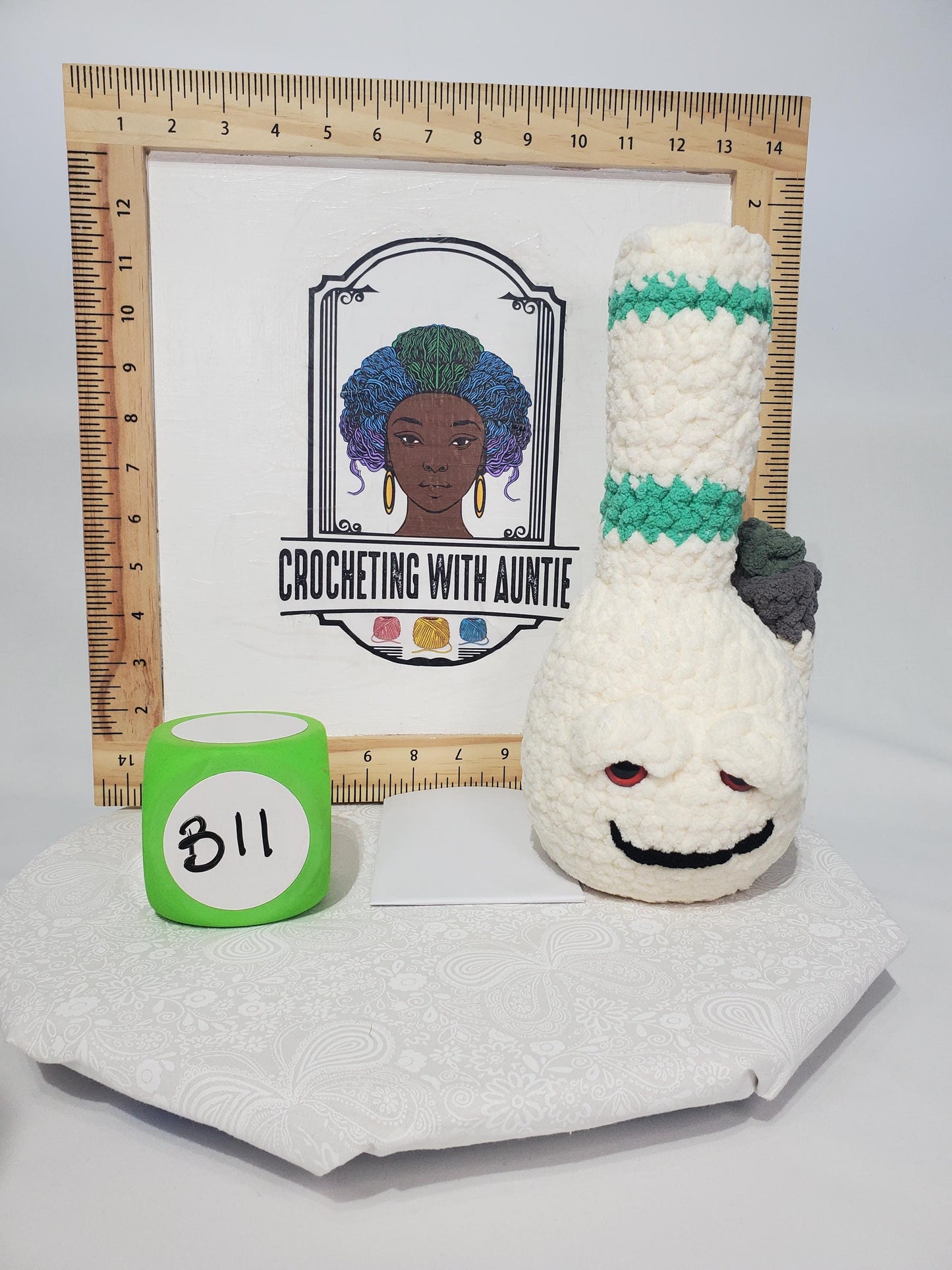 B11: Crochet Bong, White and Teal, made with 100% polyester, soft blanket yarn, has safety eyes, approx. 11" x 4", 7 oz