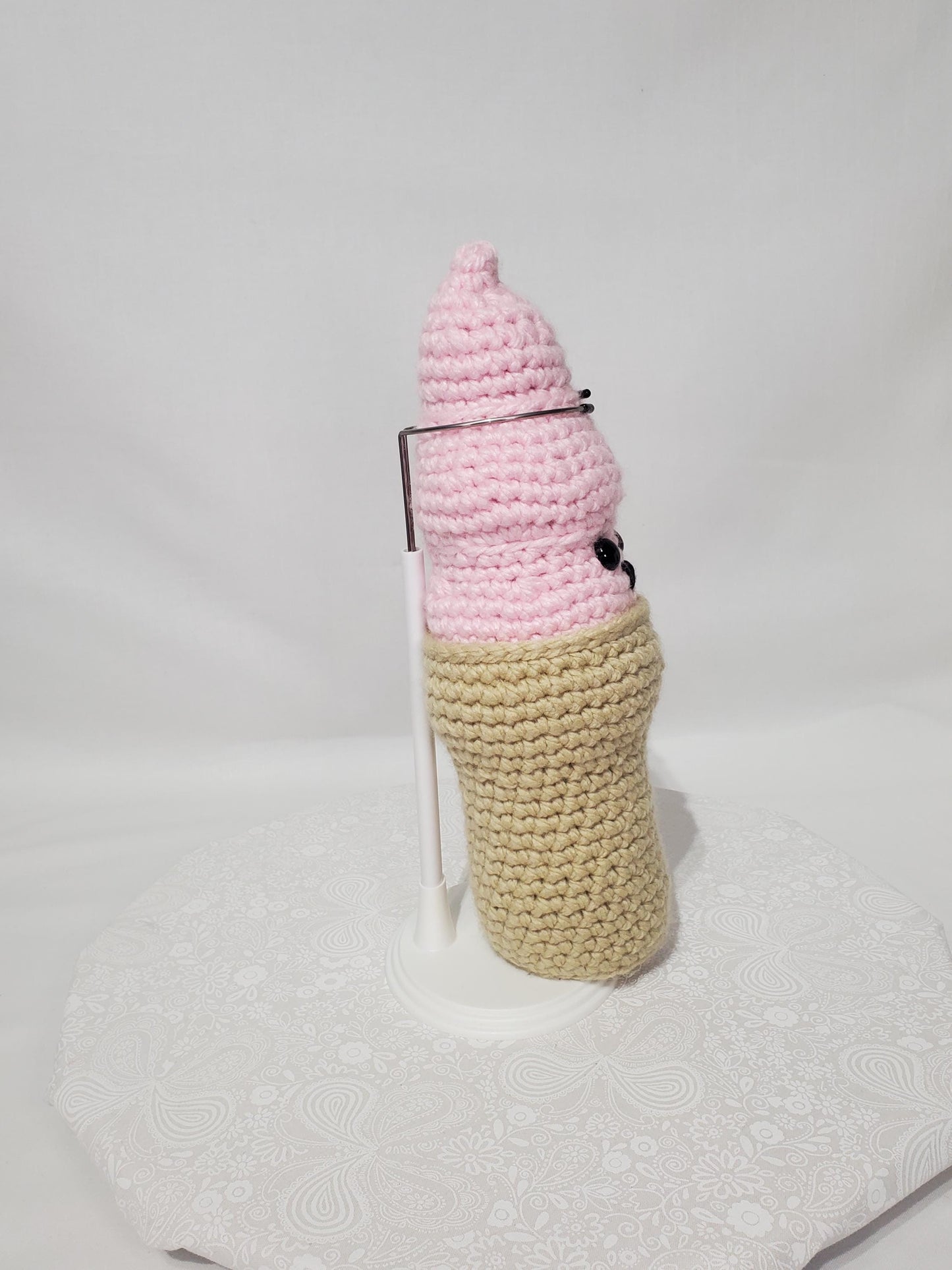 T23: Crochet Swirl Ice Cream Cone, made with 100% acrylic yarn, fiber fill, and plastic safety eyes
