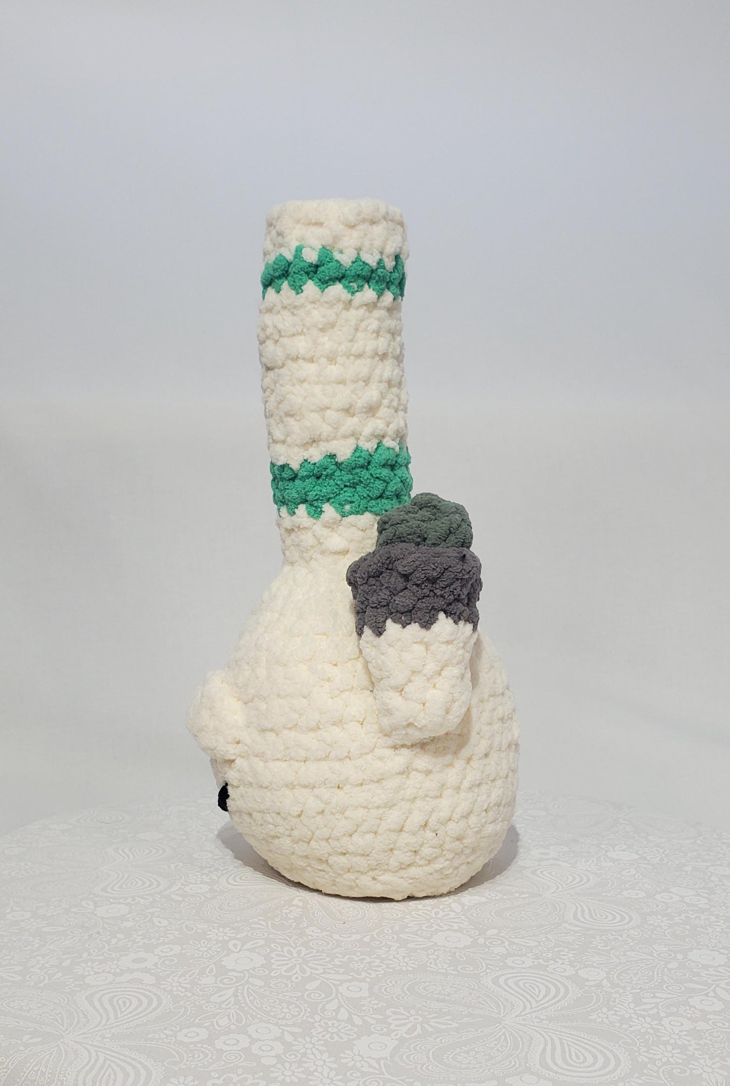 B11: Crochet Bong, White and Teal, made with 100% polyester, soft blanket yarn, has safety eyes, approx. 11" x 4", 7 oz