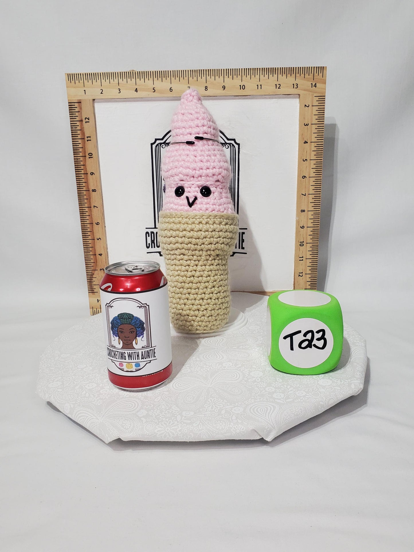 T23: Crochet Swirl Ice Cream Cone, made with 100% acrylic yarn, fiber fill, and plastic safety eyes